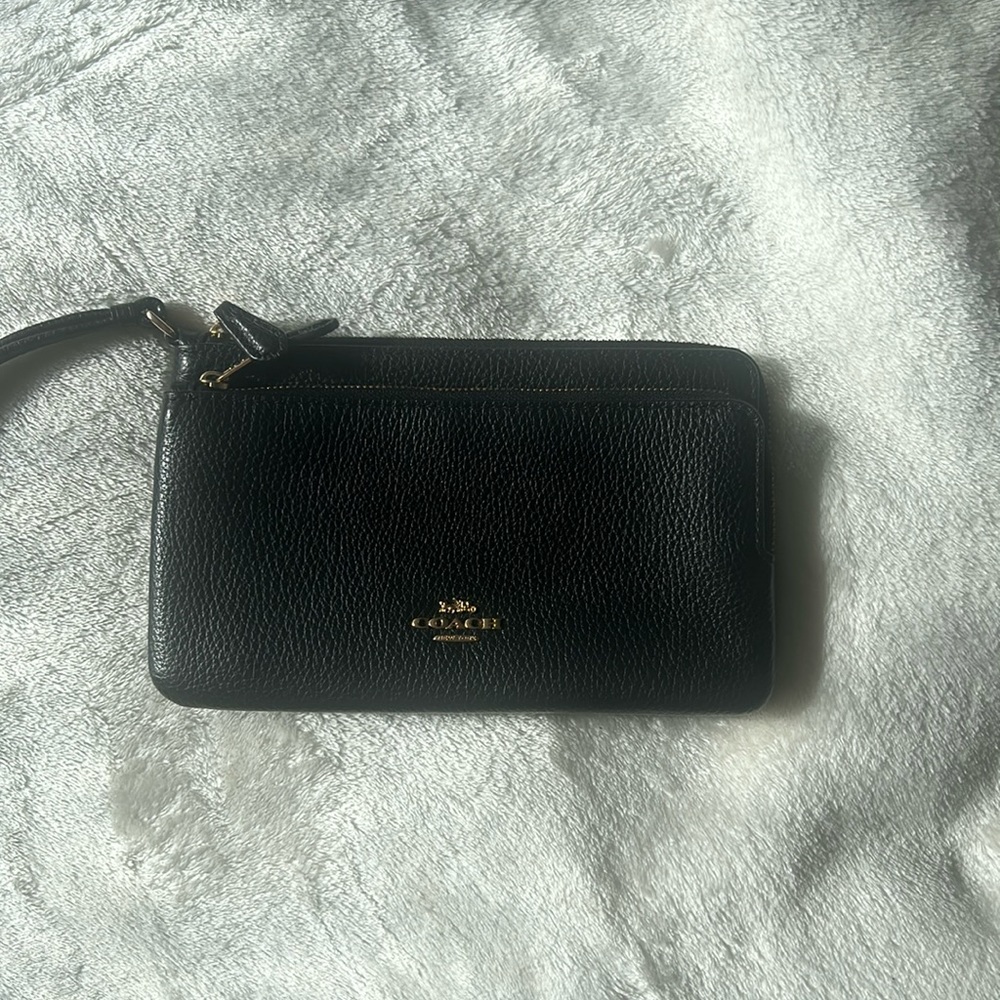 A black Coach wallet